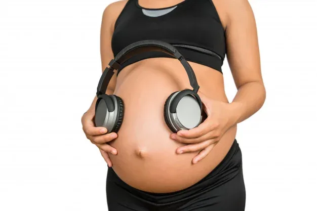Figure 2: Familiarizing her fetus with a recording. 